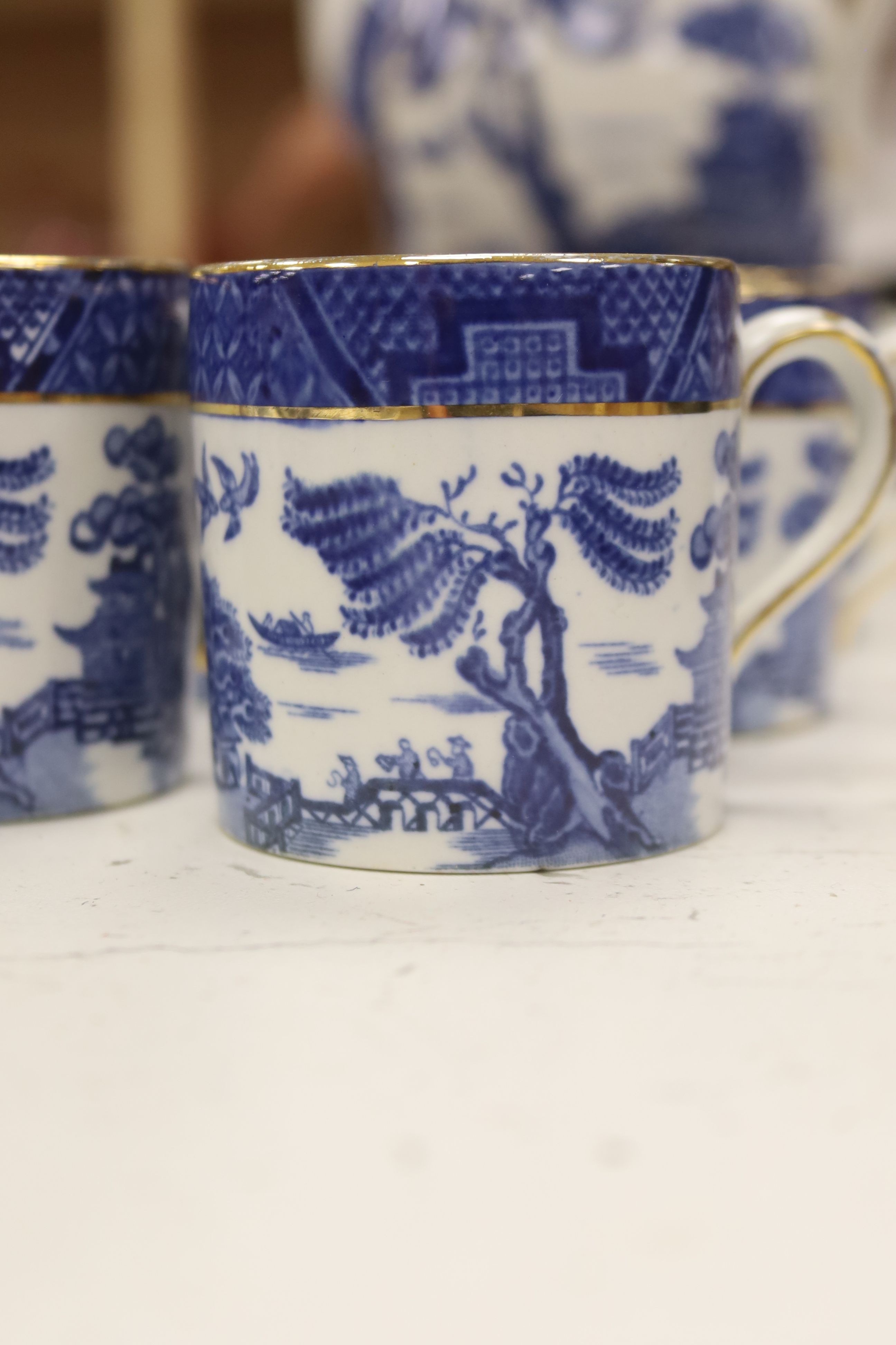 A Wedgwood blue and white willow pattern meat dish, a Copeland Spode Tower pattern square shaped bowl & a blue and white coffee pot (3)